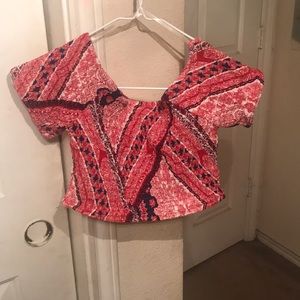 Off the shoulder crop top with ruffle sleeves .